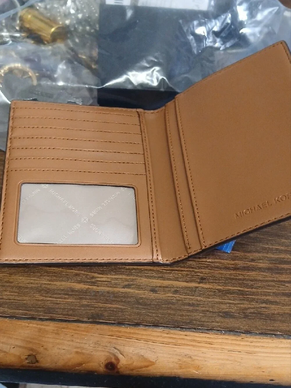 Michael Kors Brown Monogram Passport Holder with Gold Logo